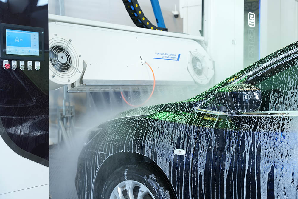 Drive-Through Car Washes - Water jets cleaning a vehicle