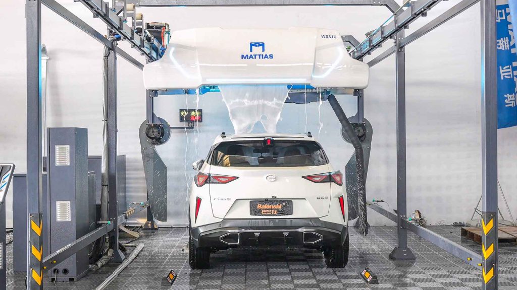 How Much Does It Cost to Build a Touchless Car Wash? 1 A modern touchless car wash bay with robotic arms and foam application